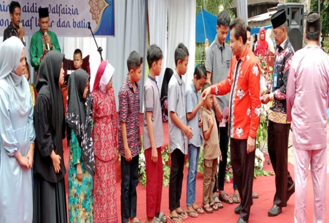 Pj Bupati Kampar Buka Acara di Desa Kuok, Bakela, Santunan Anak Yatim, MTQ, dan Pacu Tongkang