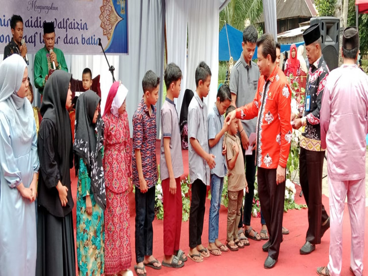 Pj Bupati Kampar Buka Acara di Desa Kuok, Bakela, Santunan Anak Yatim, MTQ, dan Pacu Tongkang
